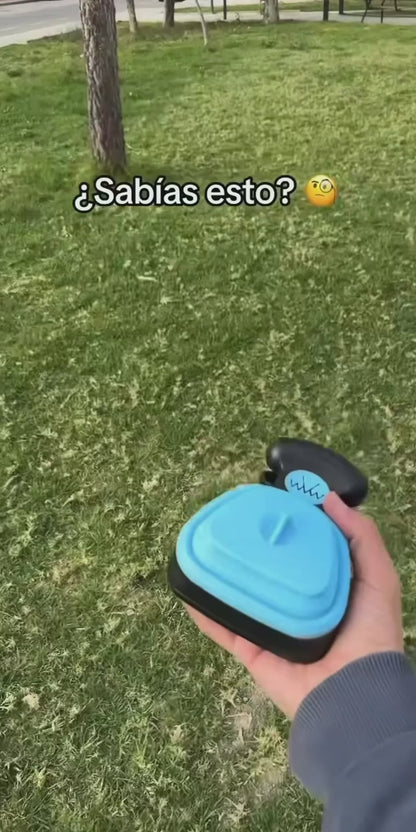 Foldable travel poop scooper in use