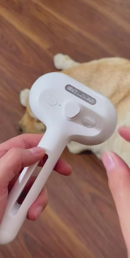 Steam spray grooming brush in use